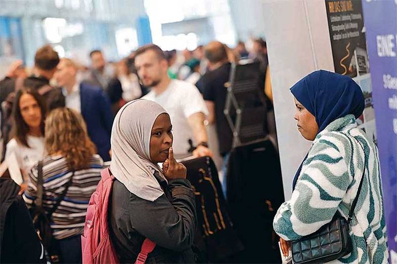 MAGO/MAUERSBERGER Улицы немецких городов трудно представить себе без мигрантов