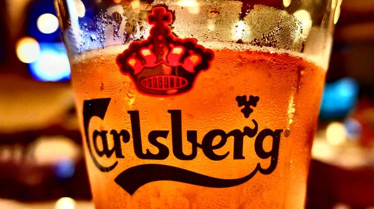 Группа Carlsberg продаст все активы в России до начала лета